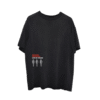 Front view of a black Imagine Dragons T-Shirt featuring small red and white "Live in Vegas" text with three white cactus graphics.