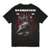 Back of black Rammstein T-Shirt with a dark plague doctor design, red ropes, hands on bars, and “Rammstein EST. 1994” printed at the top.